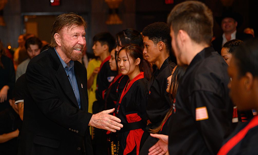 Chuck Norris With Kickstart Kids Students After Their Karate Demonstration