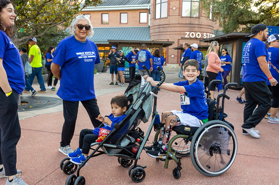 Boy Orthotics Pushing Stroller Wheelchair