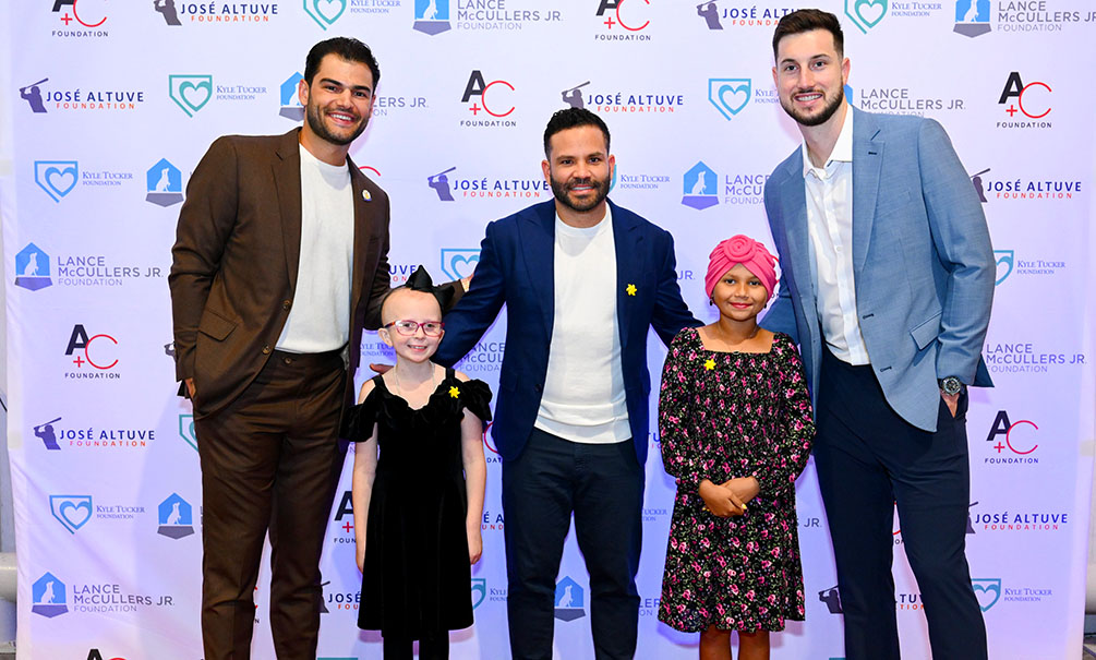 Lance McCullers, Jr., Jose Altuve and Kyle Tucker with children from Sunshine Kids (Photo by CatchLight Group)