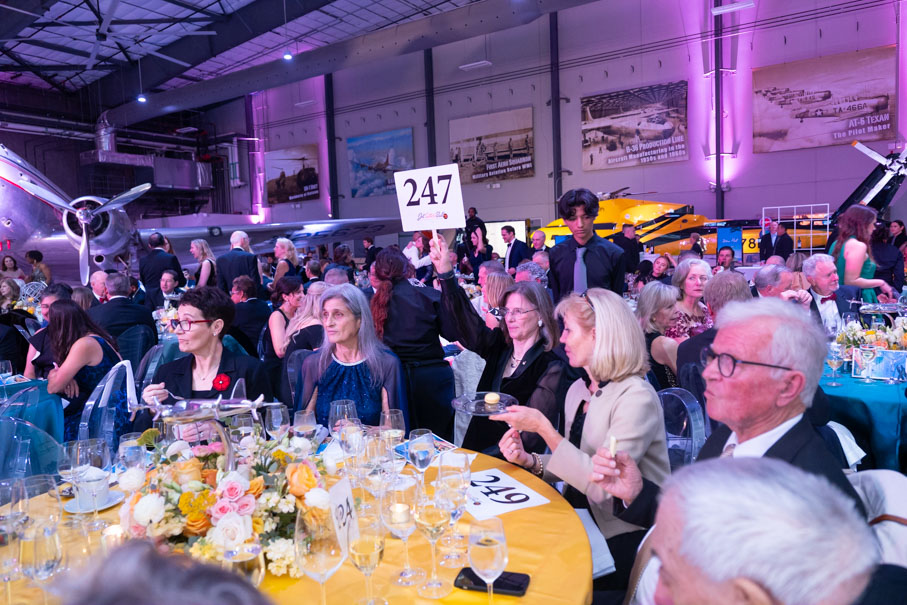 Guests Bidding On Live Auction Items In Support Of The Lone Star Flight Museum Photo By Daniel Ortiz