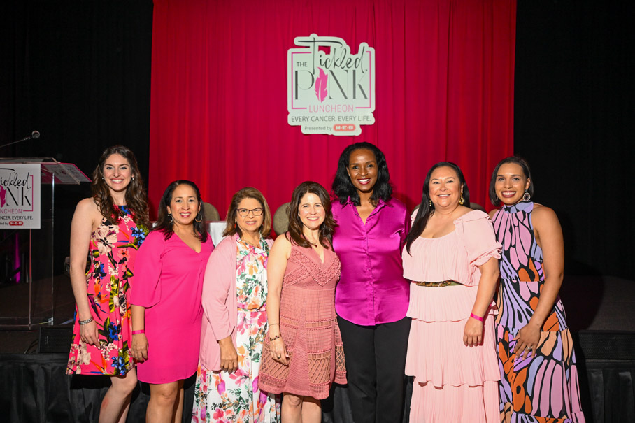 Winell Herron And H E B Team Underneath The Tickled Pink Logo Presented By H E B Photo By Daniel Ortiz